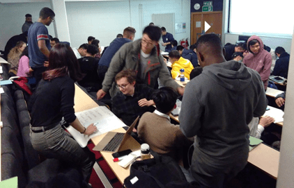 Students in cramped classroom conditions, pre covid